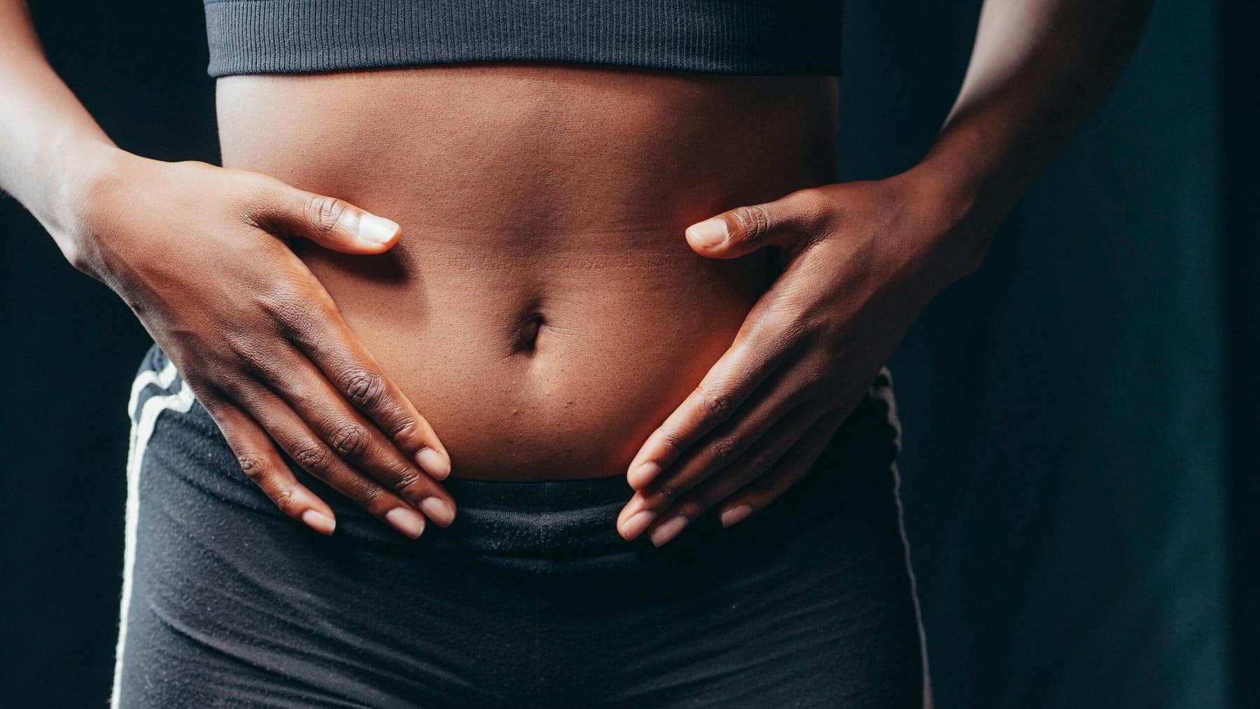 Hands resting on the stomach